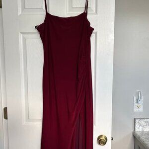 The long burgundy dress spilled out from the side
